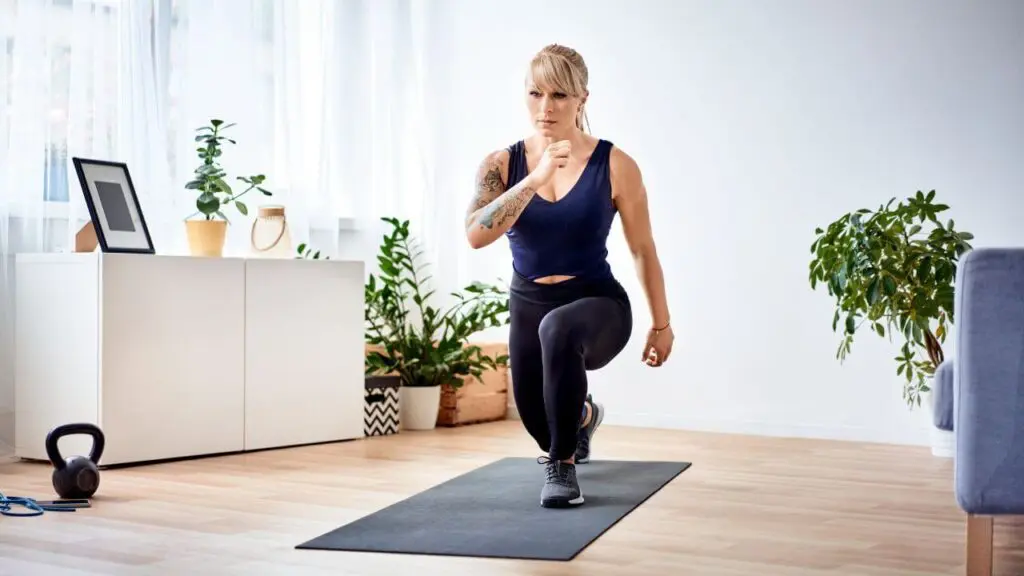 Woman performing lunges at home