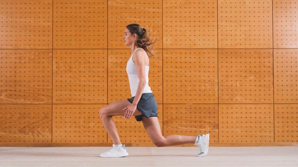woman performing walking lunges