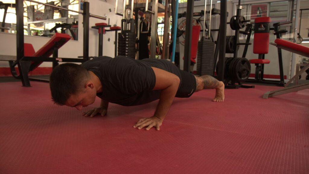 man doing push-ups with his bodyweight only