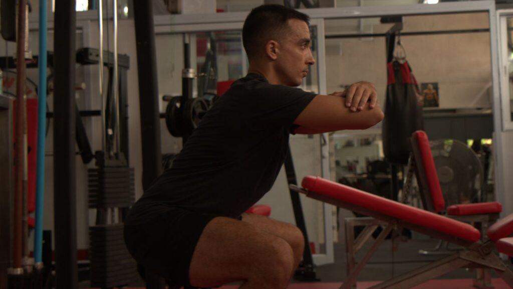 man doing bodyweight squats