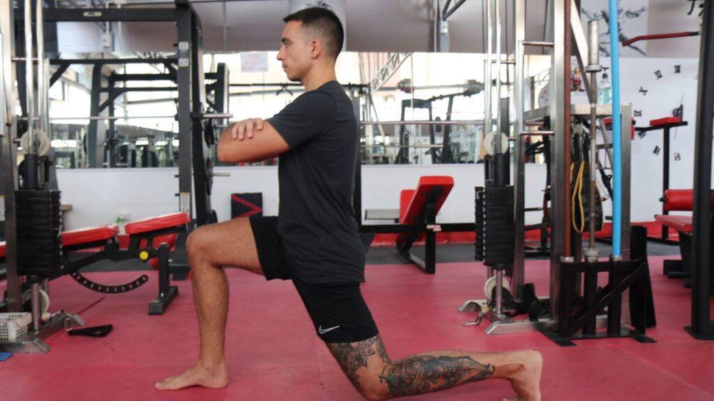 Man doing reverse lunges