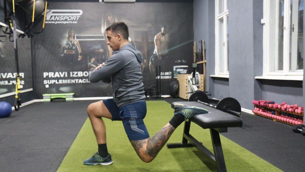 Radomir performs Bulgarian split squats.