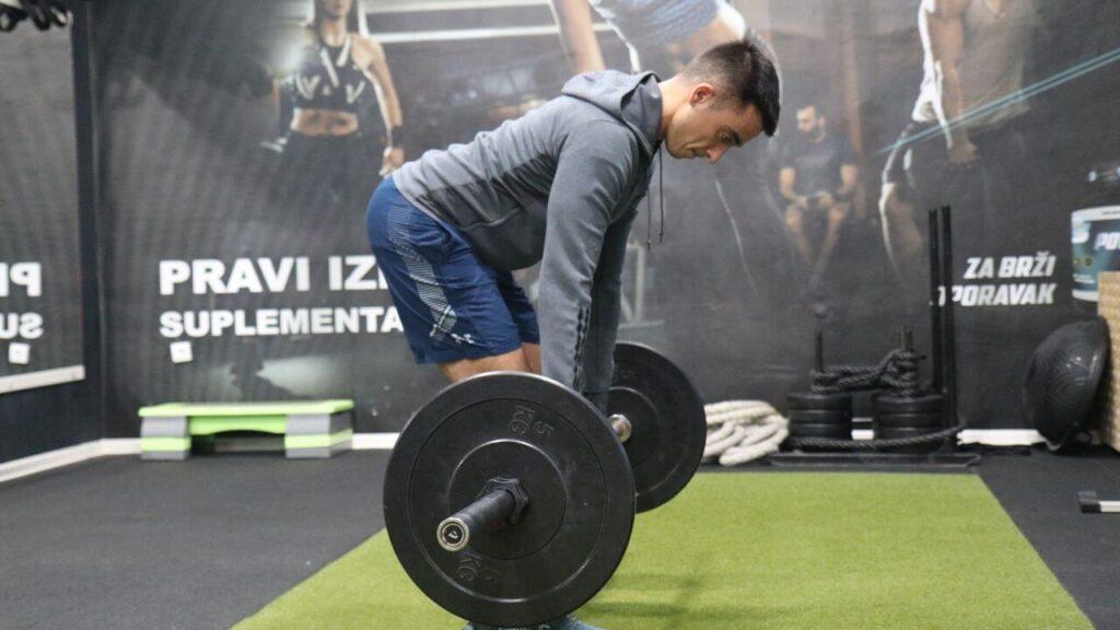 Radomir performs Romanian deadlifts.