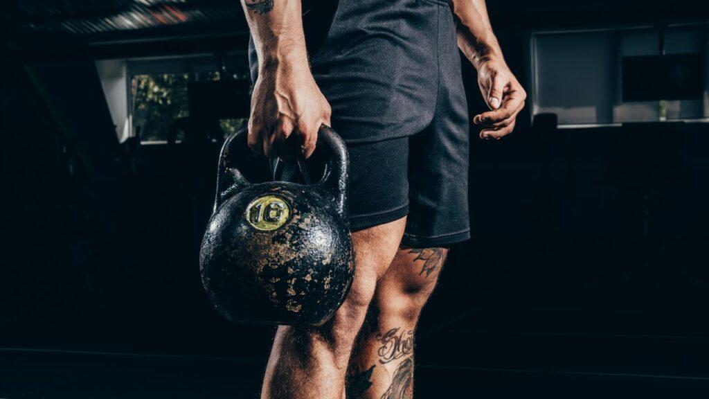 Man doing kettlebell farmers carry