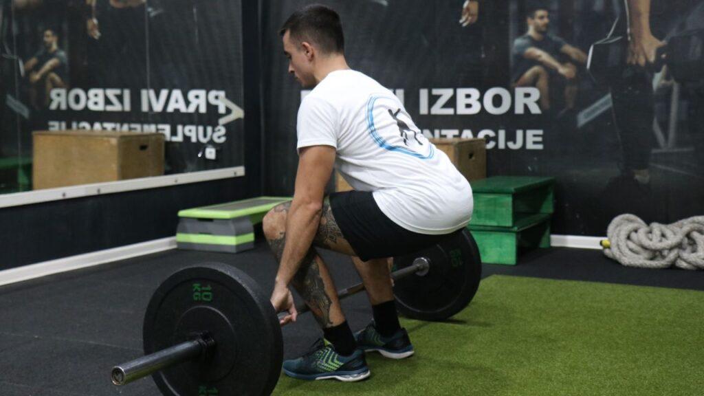 Coach Radomir performs traditional barbell deadlifts.