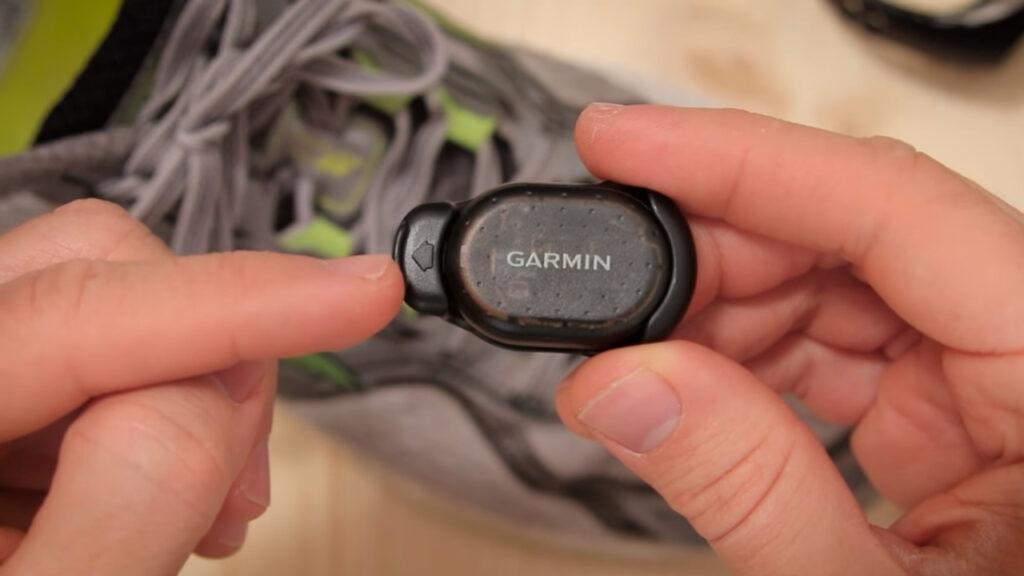 Holding the Garmin Foot Pod before running